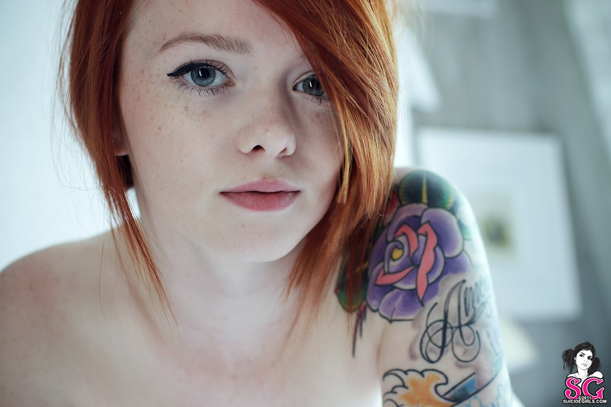 Cute Redhead Girl Puts On A Bedroom