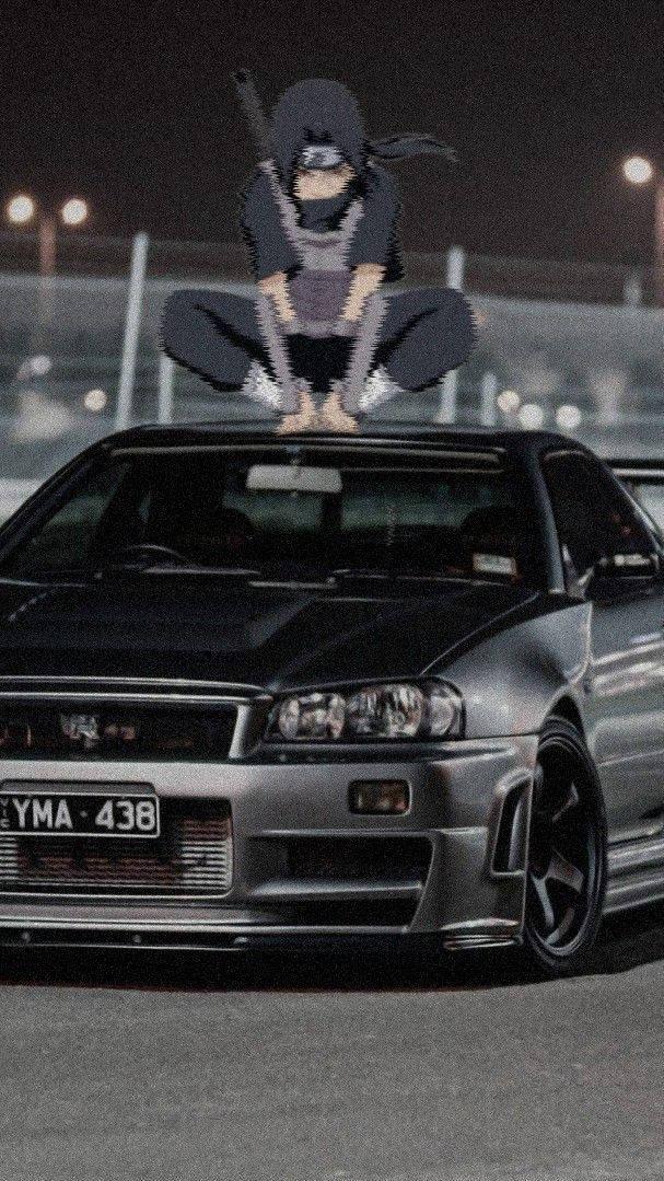 Itachi Crouching On A Car Anime Wallpaper