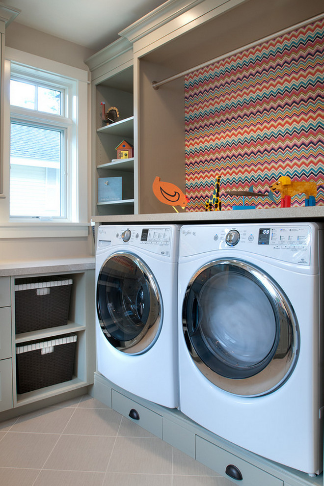 Laundry Room features gray cabinets and a colorful chevron wallpaper