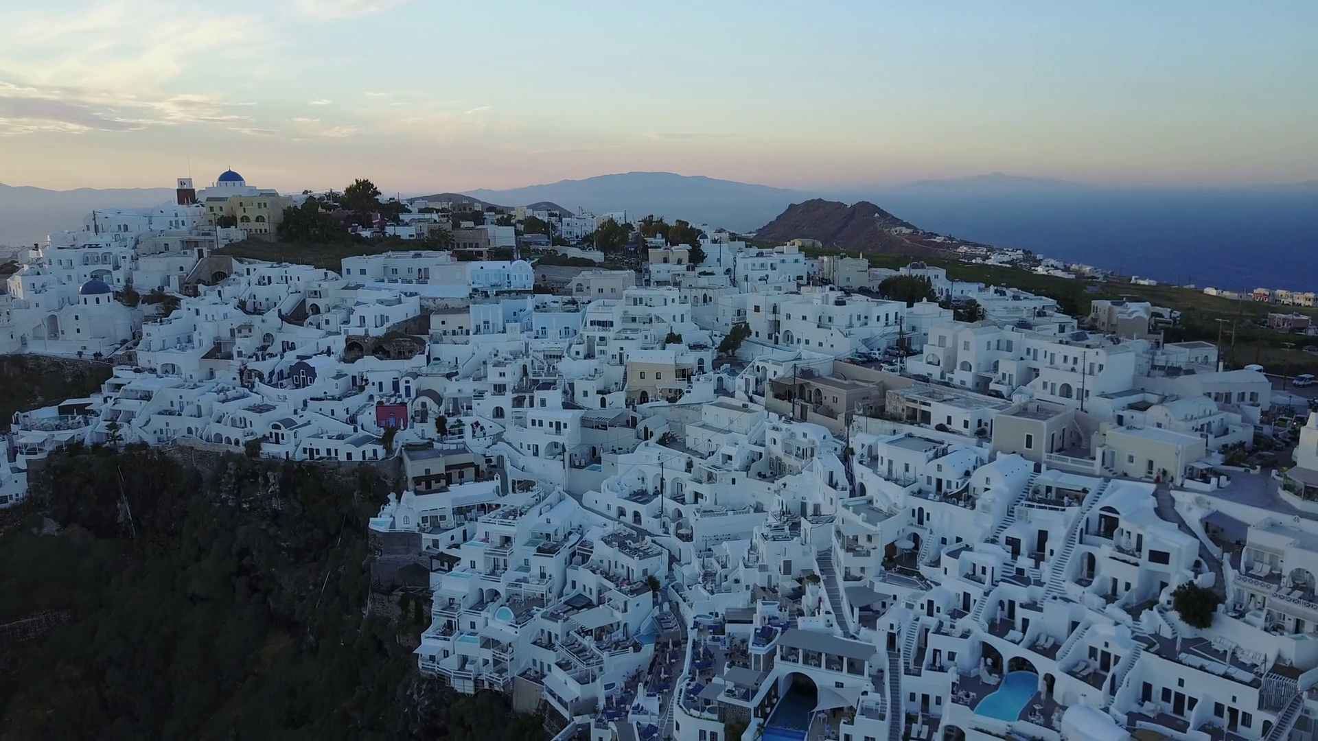 Aerial Footage Of A Cliffside Village At Sunrise In Santorini