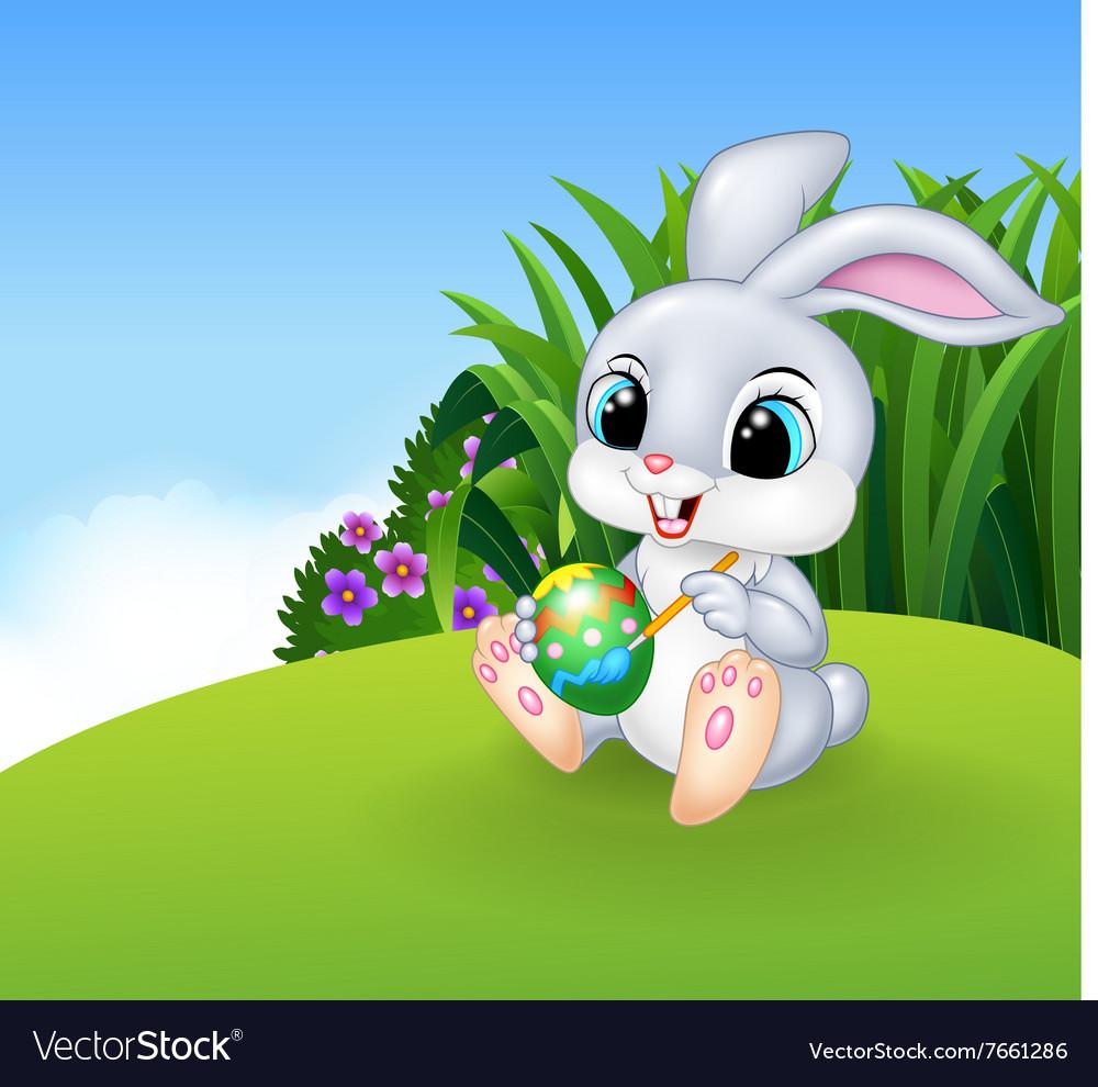Cute Easter Bunny Painting An Egg On The Meadow Vector Image