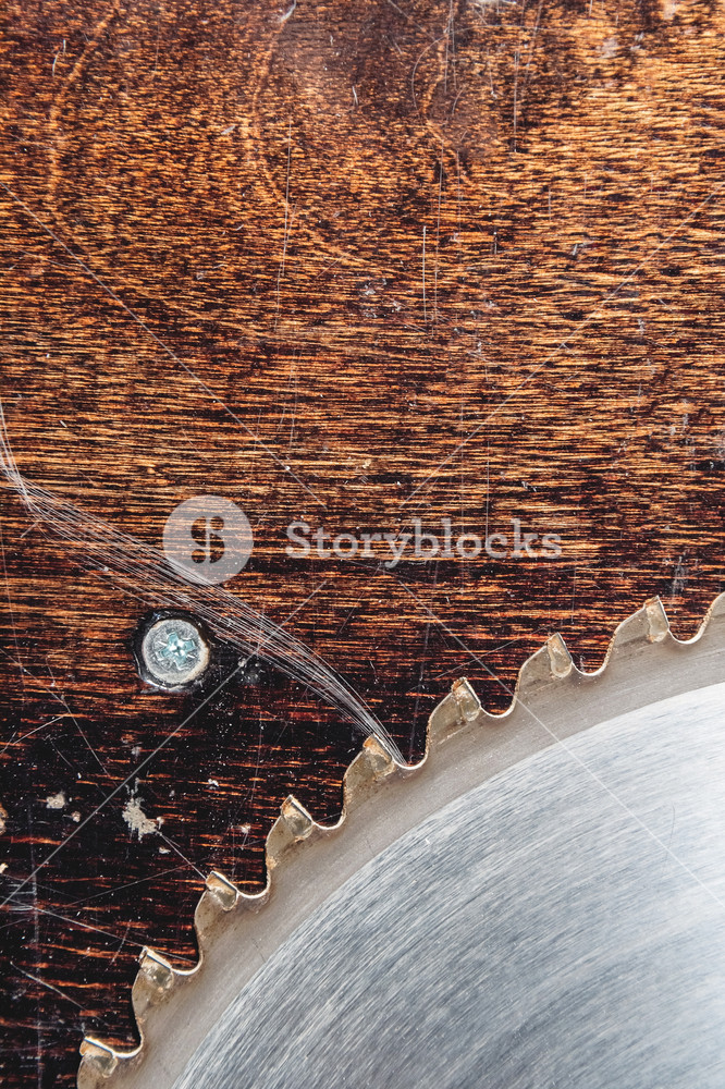 Close Up Used Blade Circular Saw On The Background Of Wooden