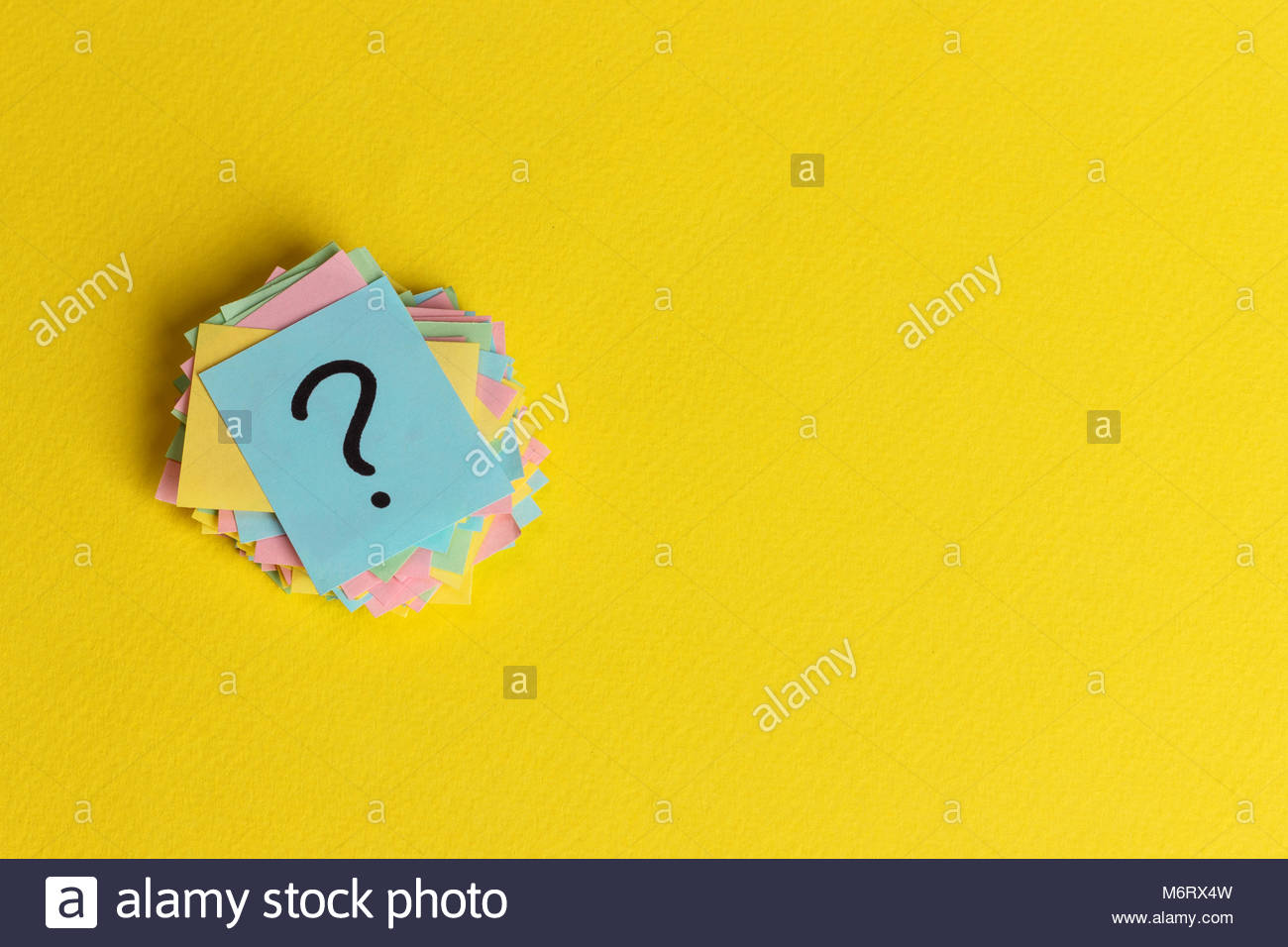 question marks written reminders tickets on yellow paper
