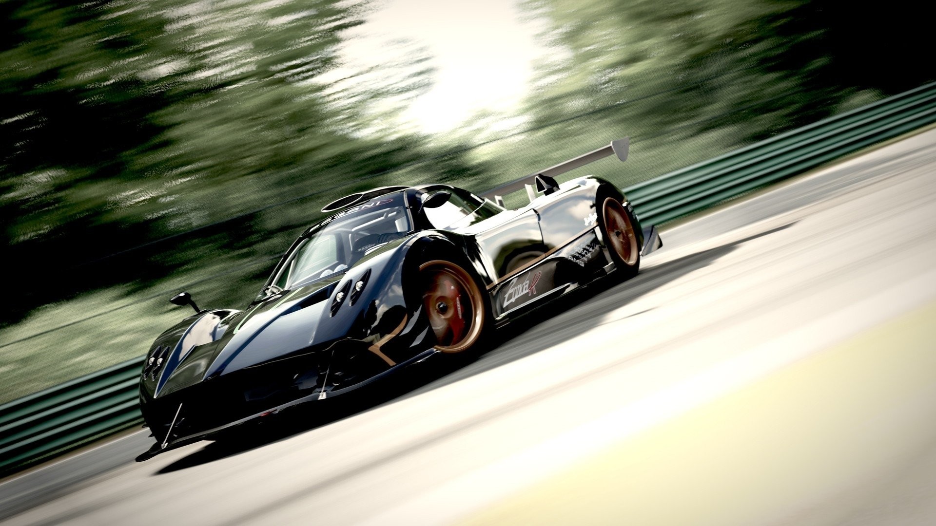 A black Pagani Zonda R sports car speeding on a race track