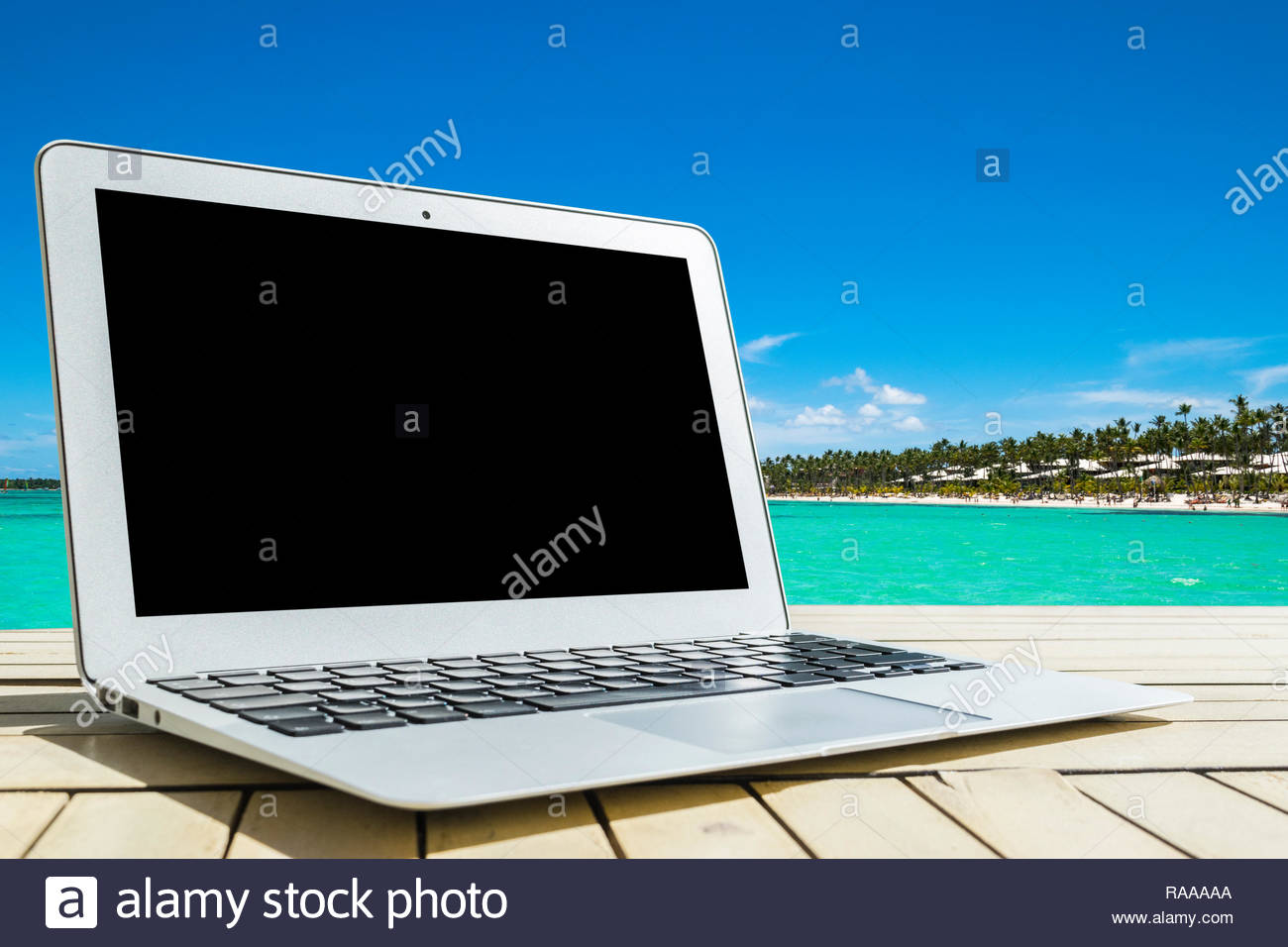 Laptop Puter On Wooden Table Top Ocean Tropical Island
