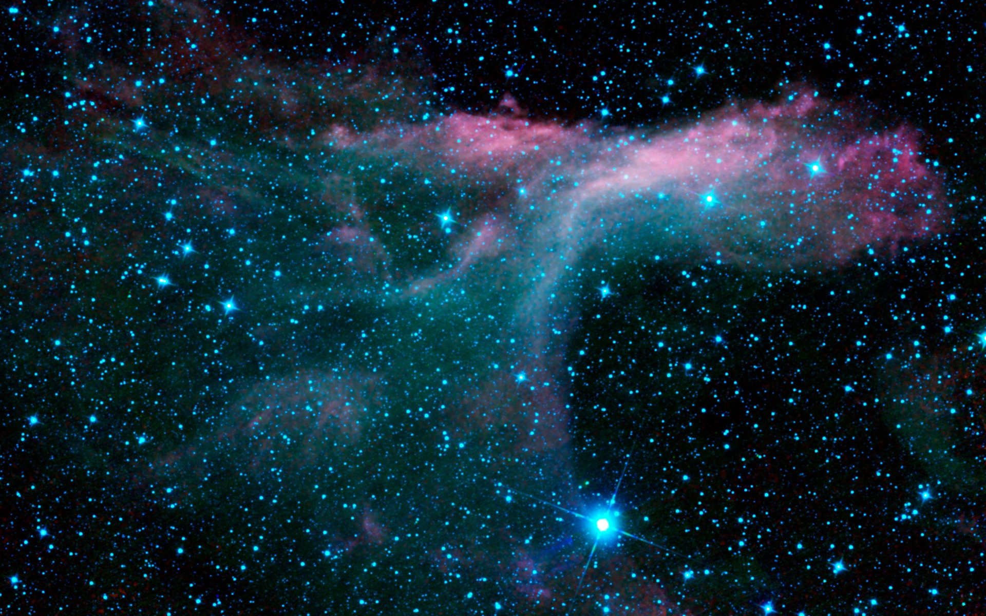 Vivid nebula with bright blue stars scattered across a dark cosmic backdrop. A beautiful outer space wallpaper