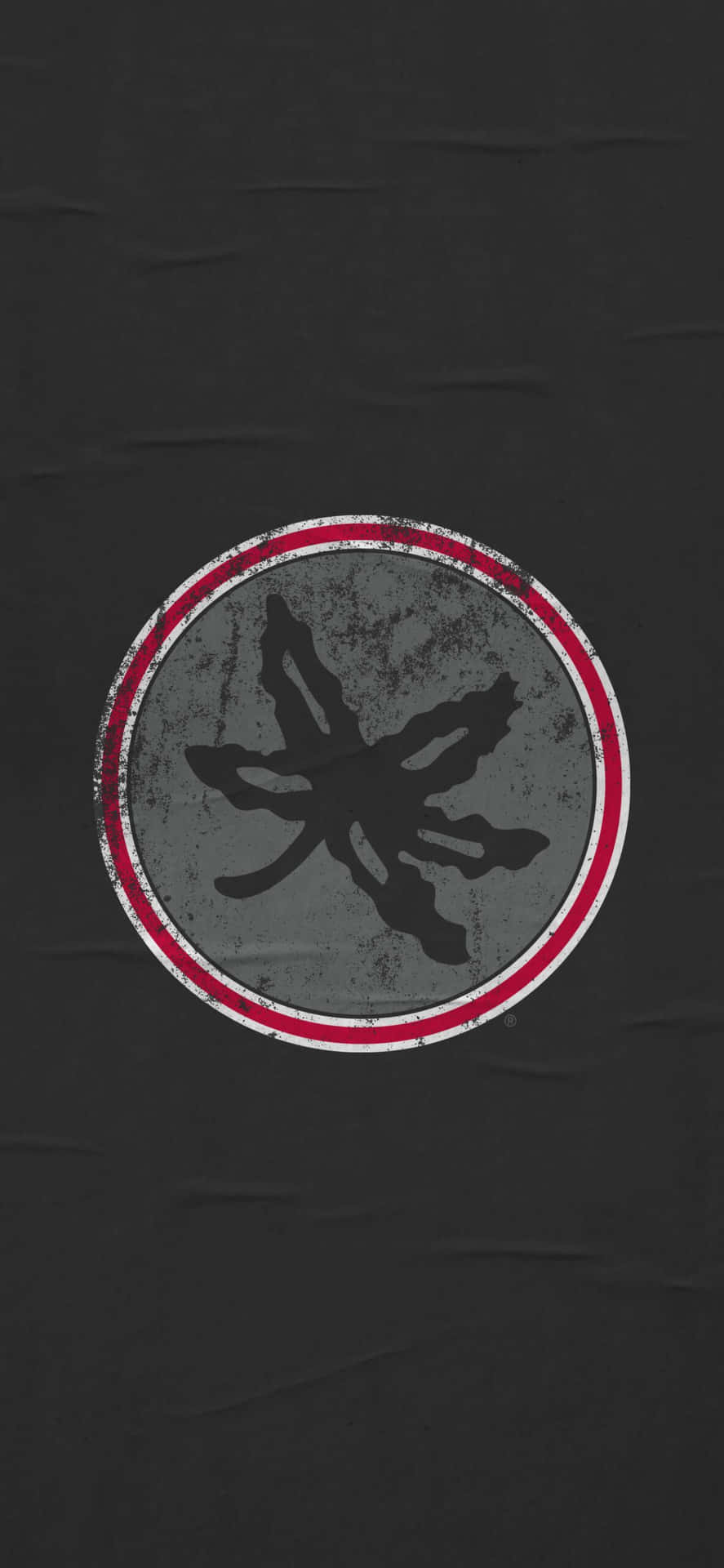 A Black Shirt With Red And White Logo Wallpaper