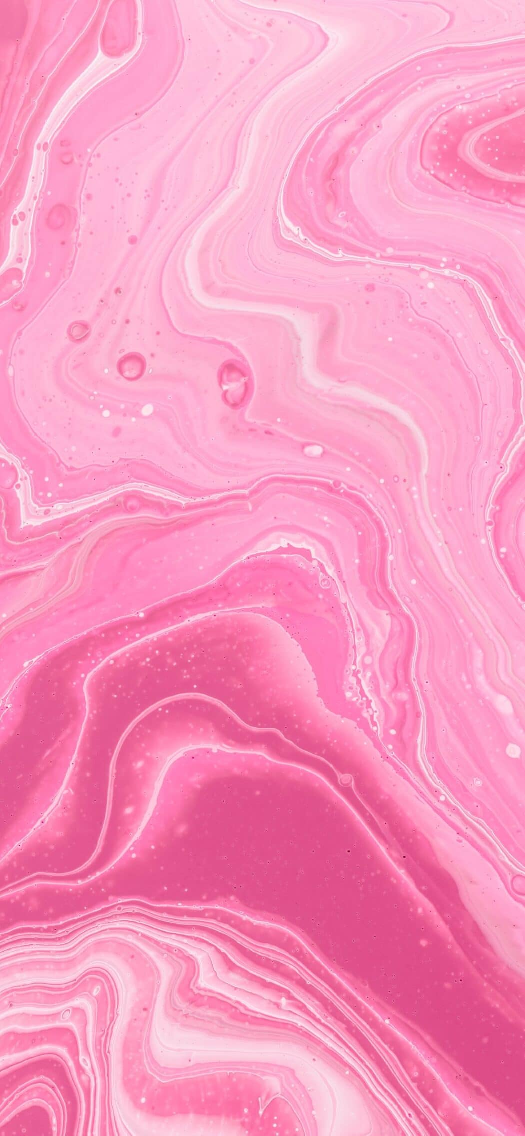 Abstract pink fluid art background with swirling patterns and textures, resembling marble or watercolor paint
