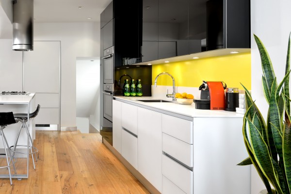 Kitchen With A Yellow Cake Painted Backsplash From Farrow And Ball