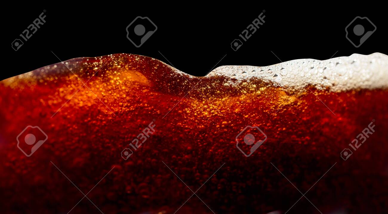 Close Up Of Coffee Splashes On A Black Background Saved Clipping