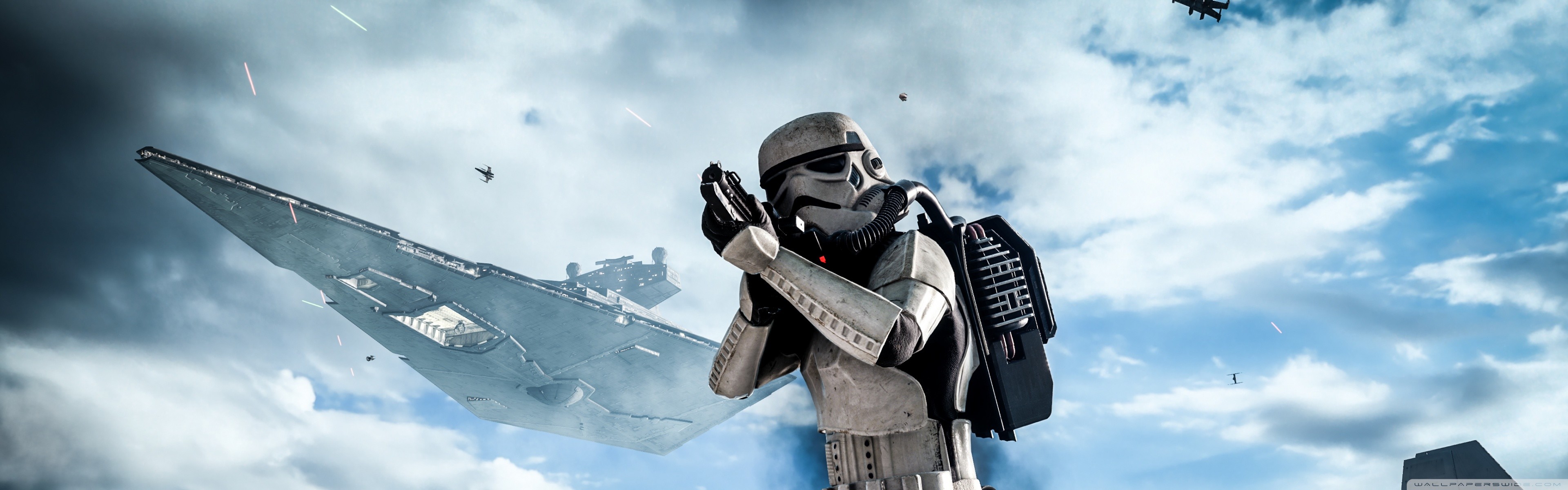 A stormtrooper from Star Wars Battlefront stands against a backdrop of an Imperial Star Destroyer in the sky