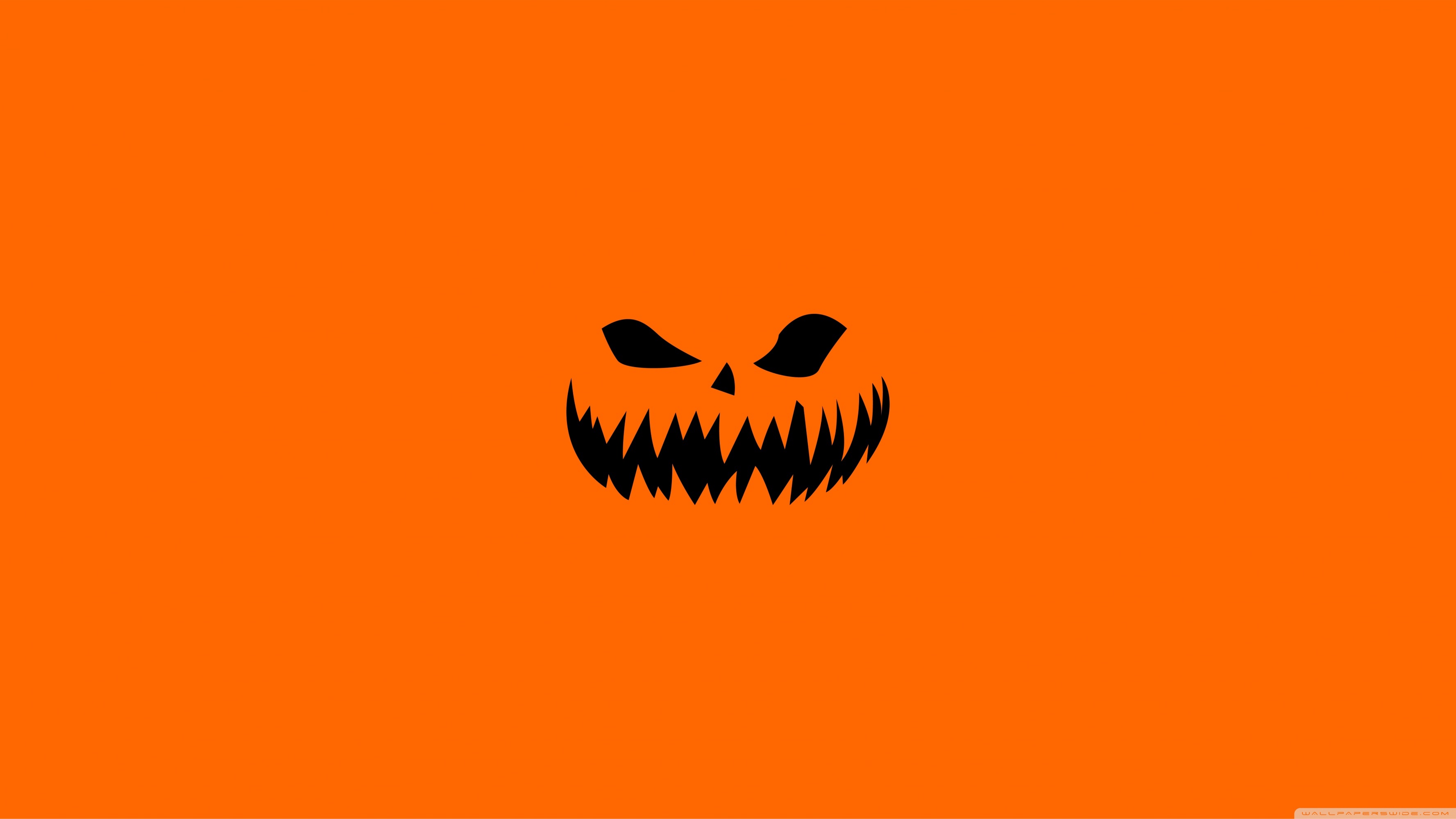 Scary Halloween Face On Orange Background Wallpaper Holidays