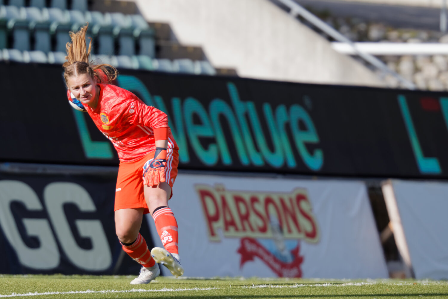 Emily Armstrong, goalkeeper for the Orlando Pride, dives to make a save during an NWSL match