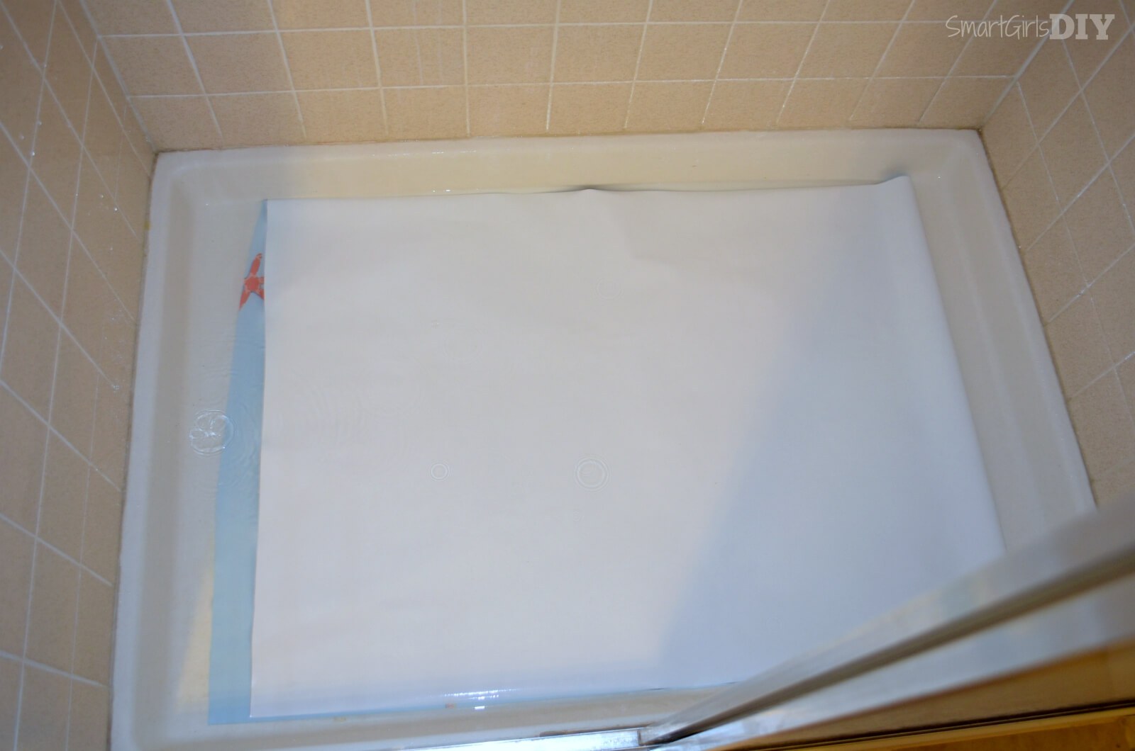 Soaking extra wide wallpaper roll in show pan    worked like a charm