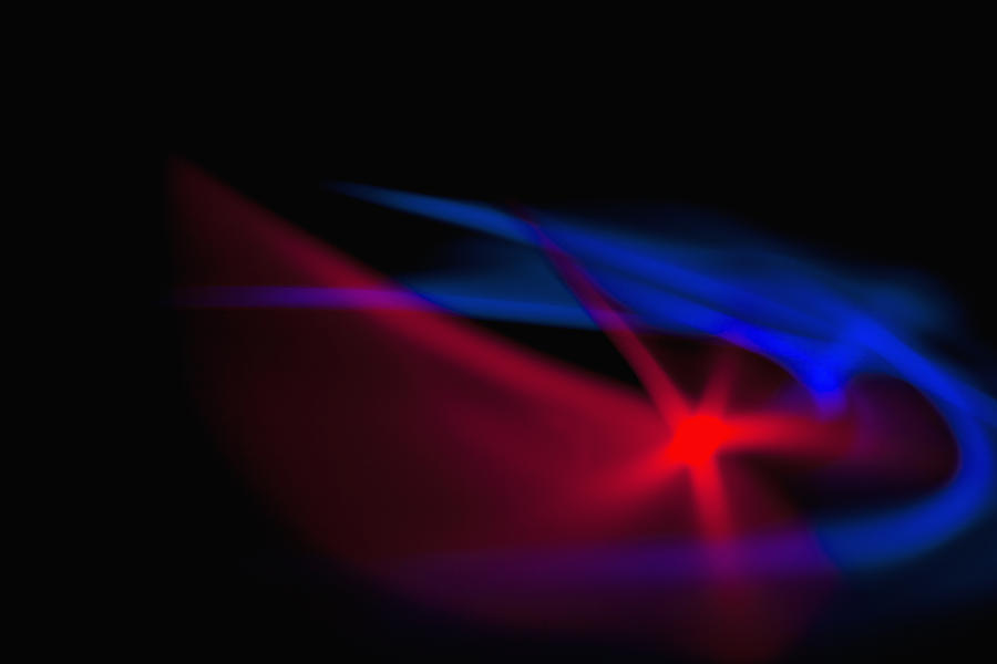  Patterns Of Blue And Red Light On A Black Background Photograph