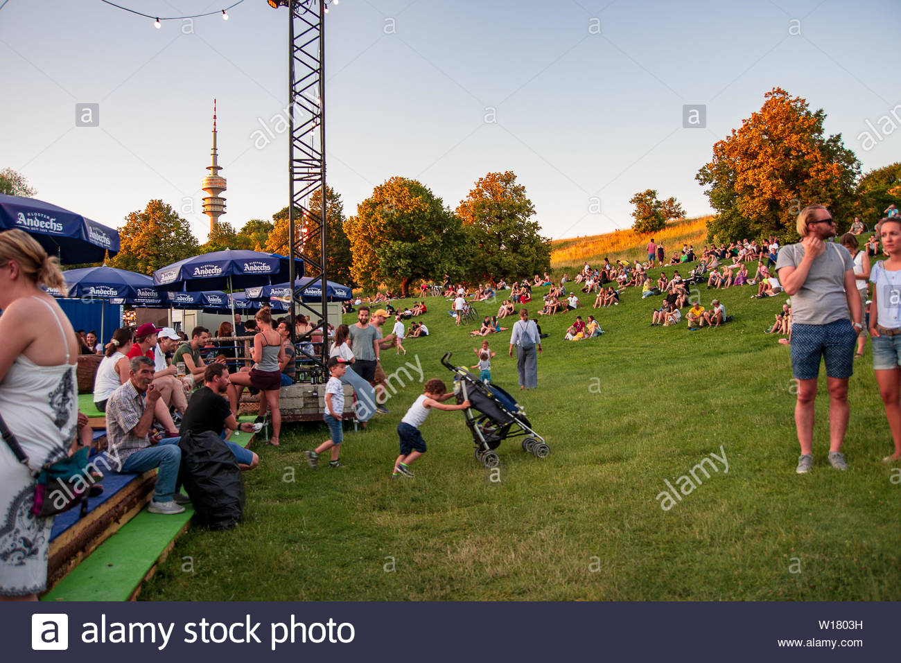 People Watch The Sunset At Festival Ground With Olympia