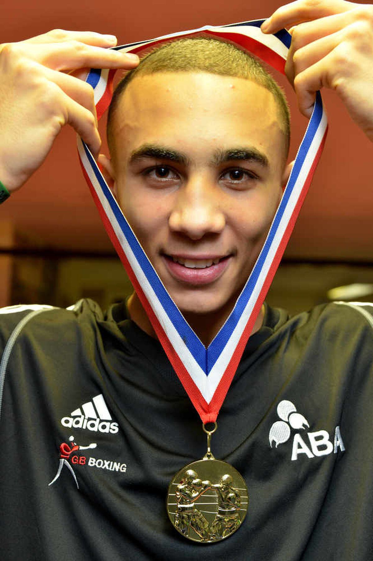 Benjamin Whittaker proudly displays his gold medal, a testament to his boxing prowess