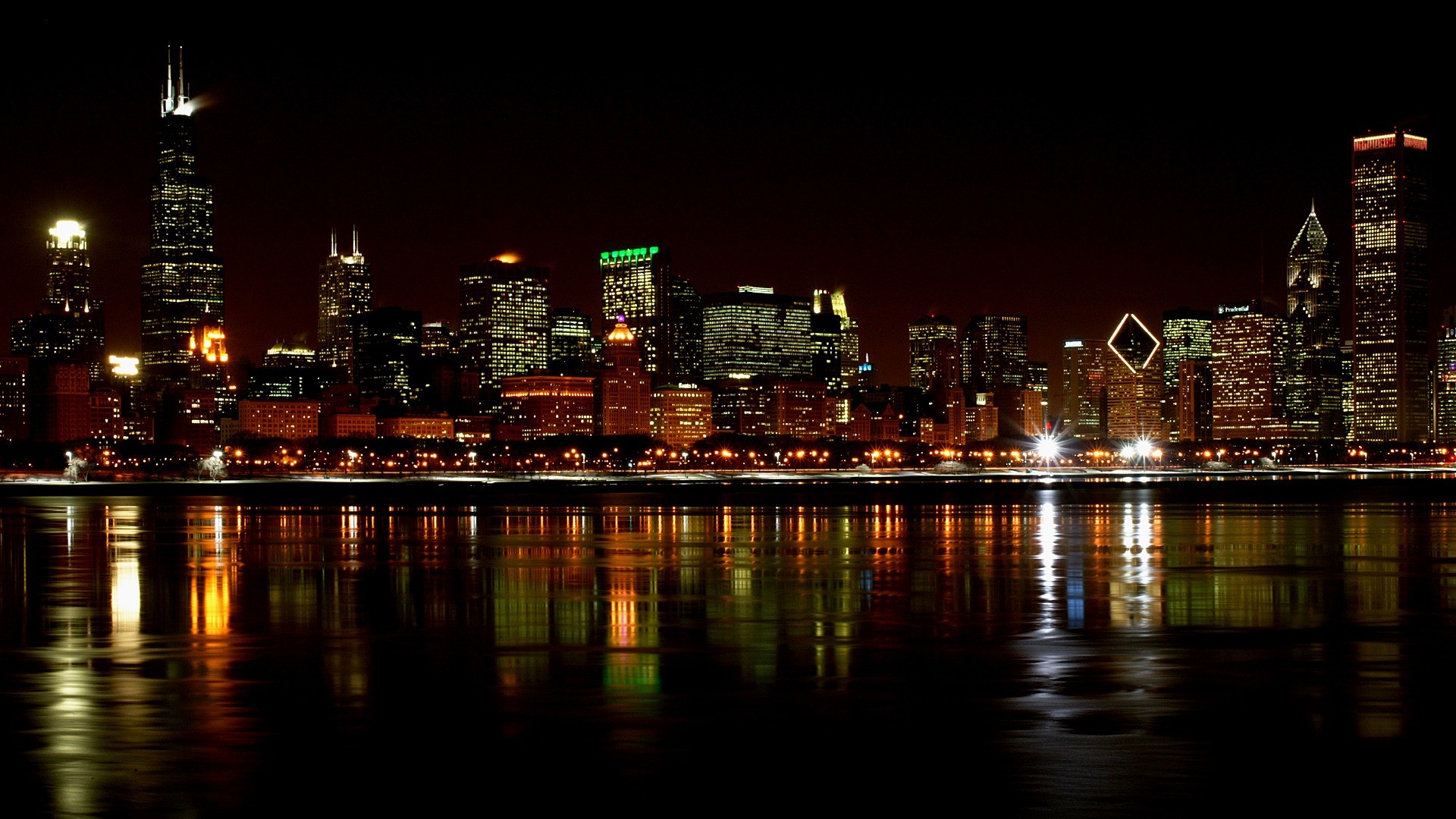 Chicago skyline at night with reflections in the water
