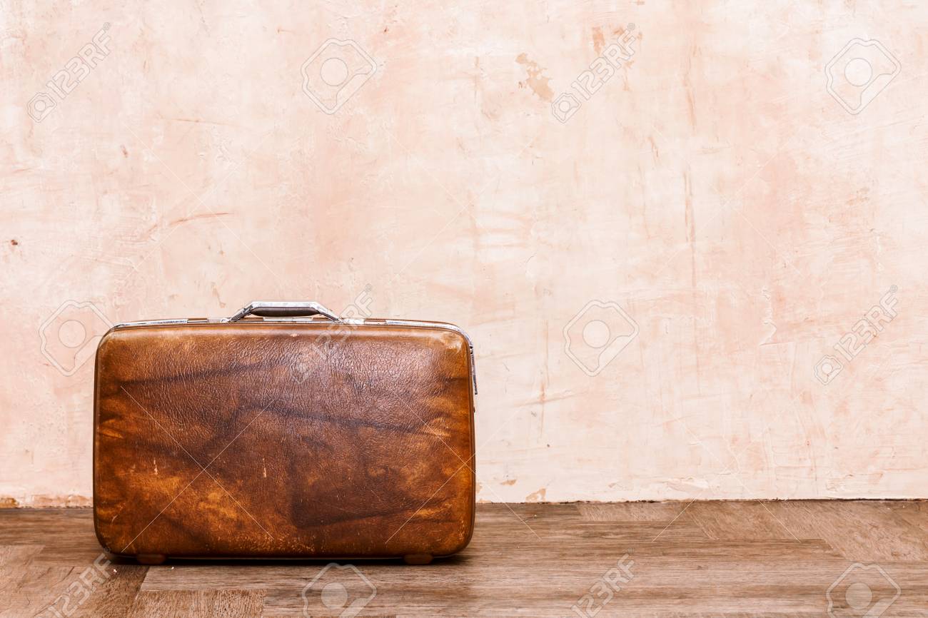 Vintage Brown Traveling Luggage On Wall Background Travel