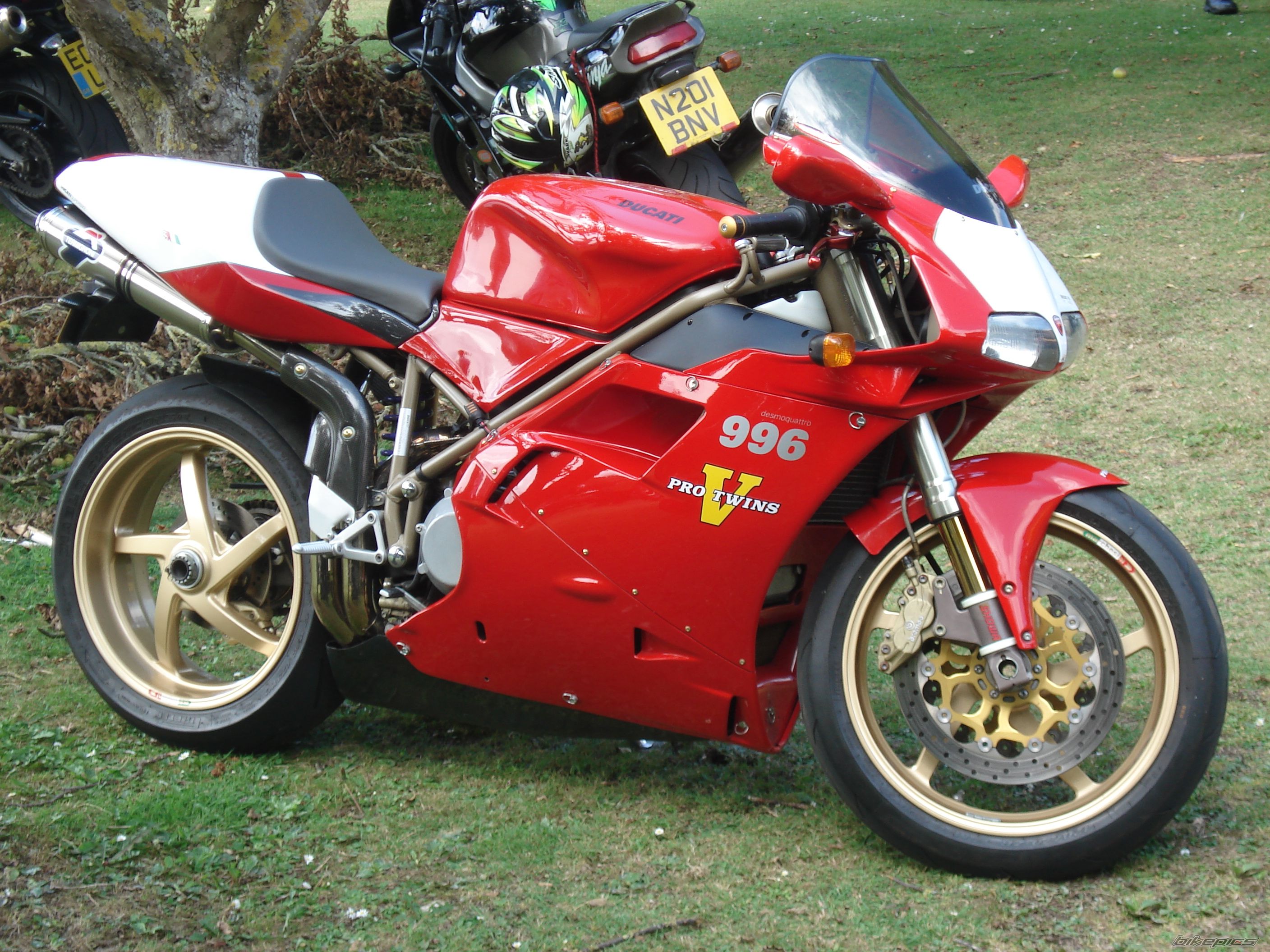 Red Ducati 996 Motorcycle Parked on Grass