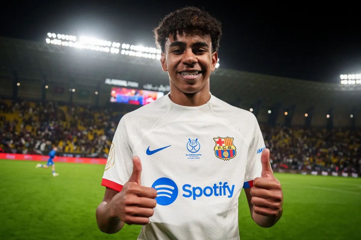 Lamine Yamal gives a thumbs up after a match, wearing his FC Barcelona jersey