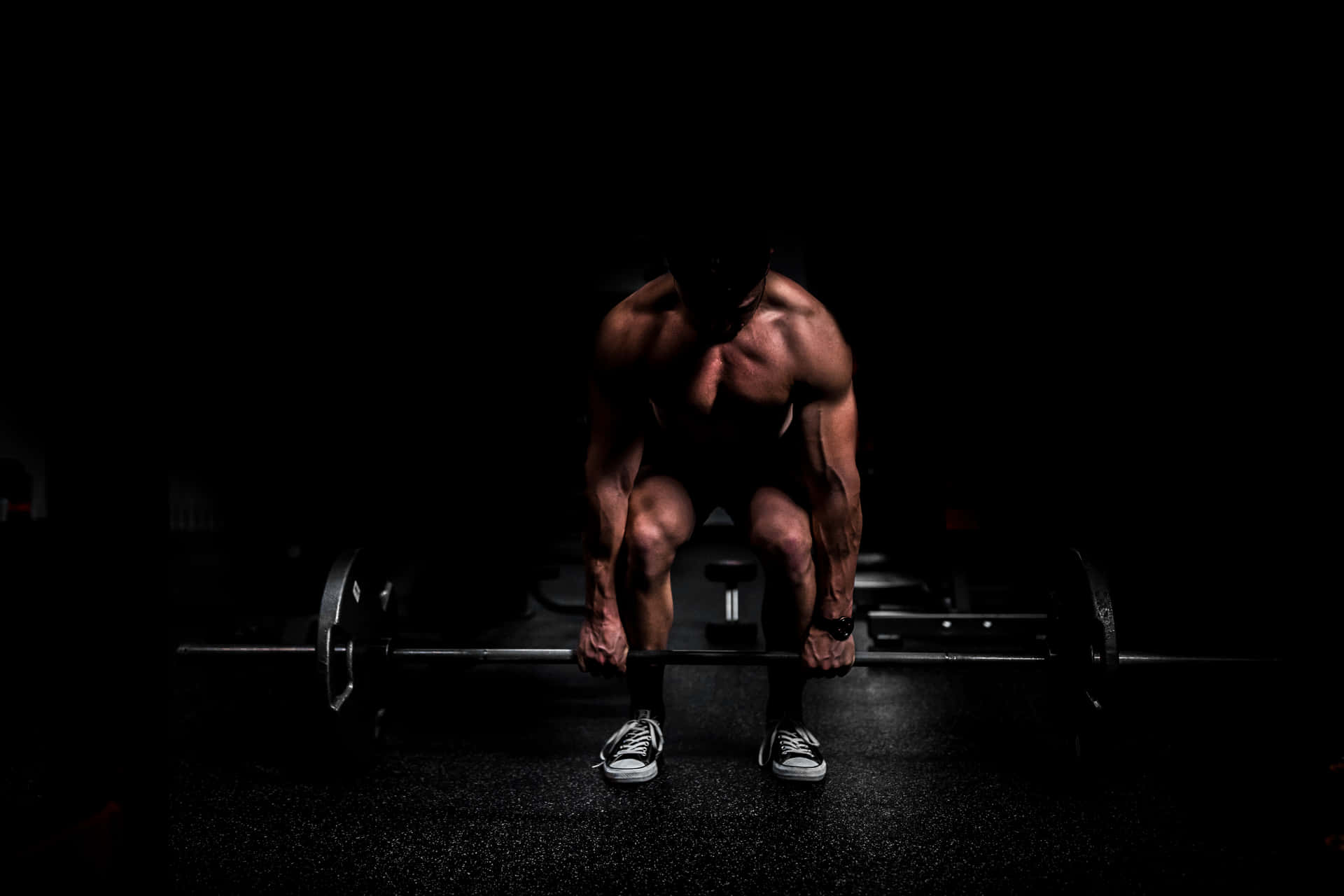 Muscular Man Doing Strength Training Wallpaper