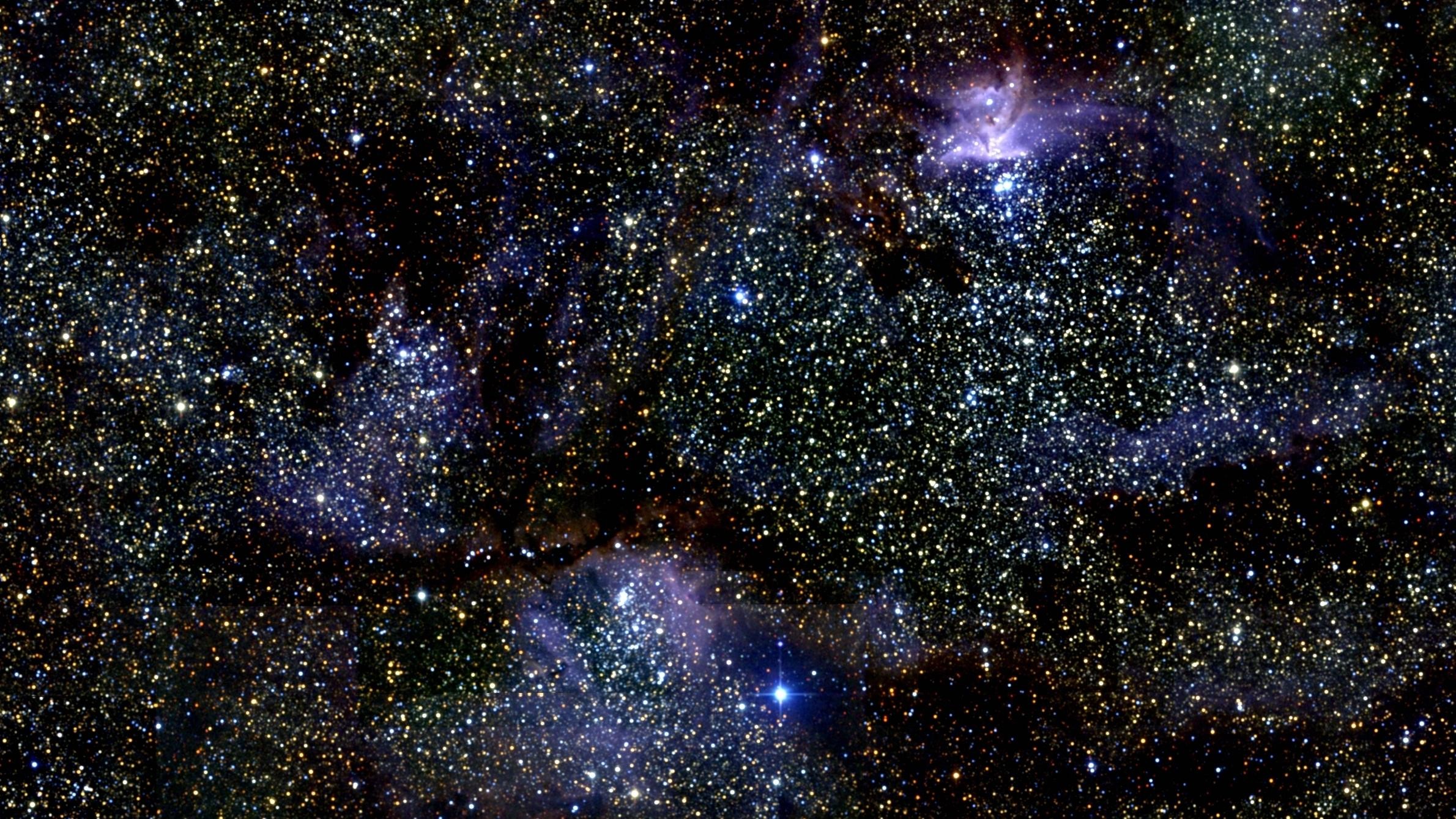 A breathtaking view of a nebula in outer space, filled with countless stars and colorful gas clouds