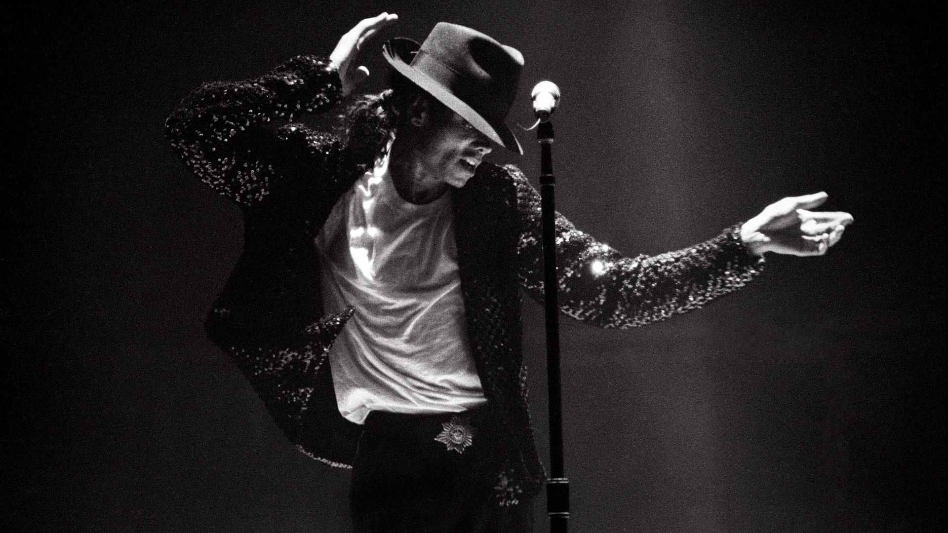 Black and white photo of Michael Jackson performing on stage