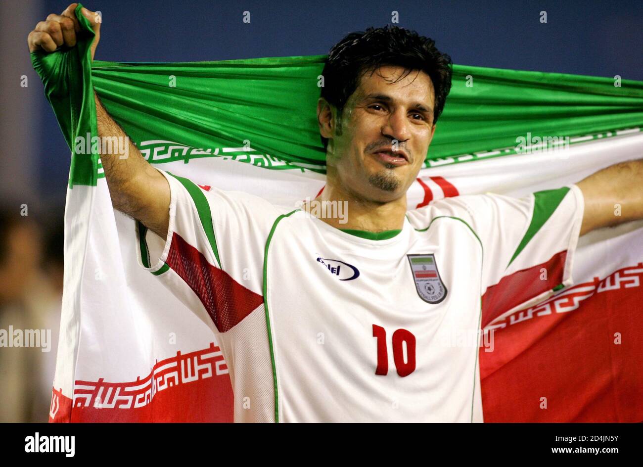 Iran S Captain Ali Daei Celebrates With His National Flag After