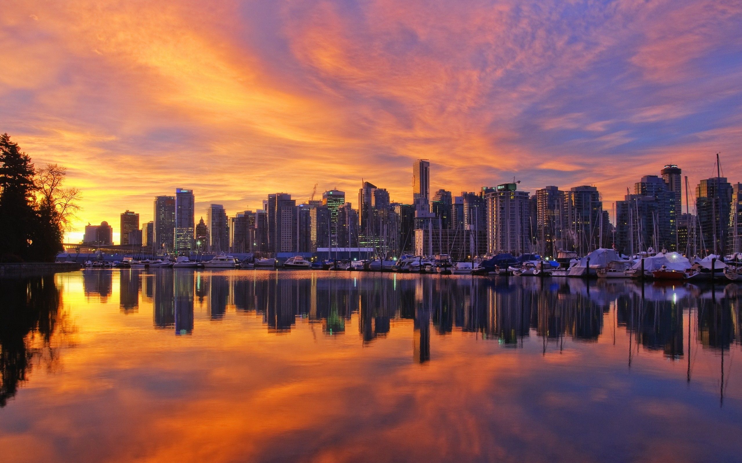 Cityscape of Vancouver at Sunset with Calm Harbor Reflection