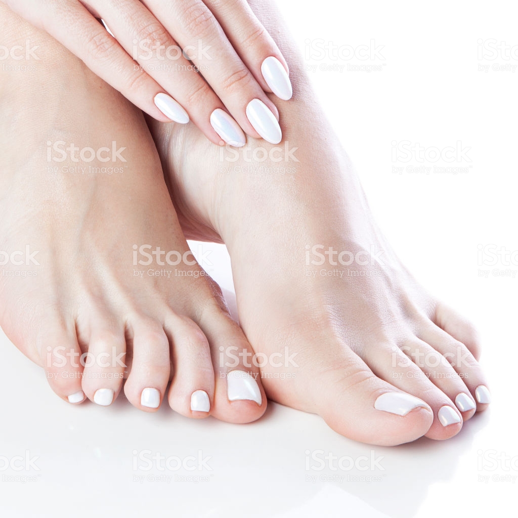 Closeup Feet And Hand Of Girl With Manicure Pedicure Nails White