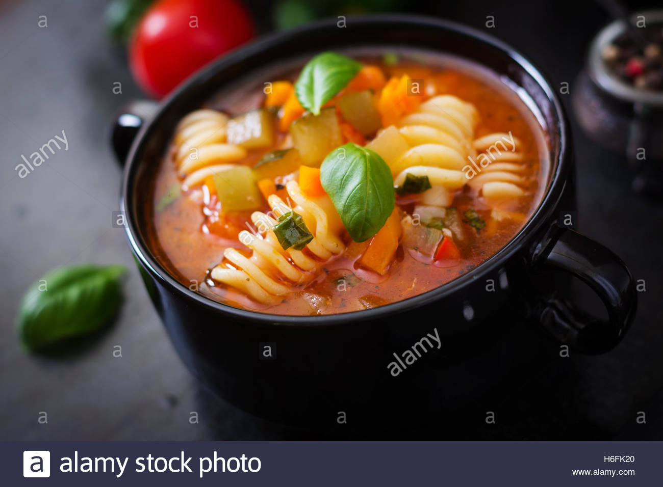 Minestrone Italian Vegetable Soup With Pasta On Black Background