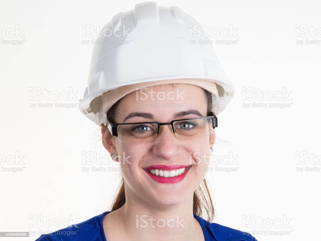 Young Woman Engineer Wearing Goggles And Safety Helmet For Girl