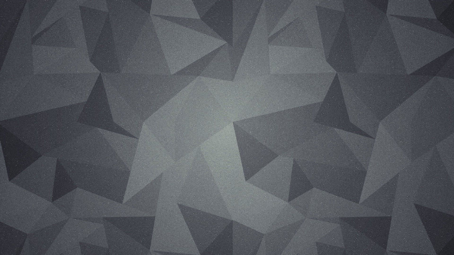Abstract geometric background with overlapping gray triangles, creating a textured and modern design