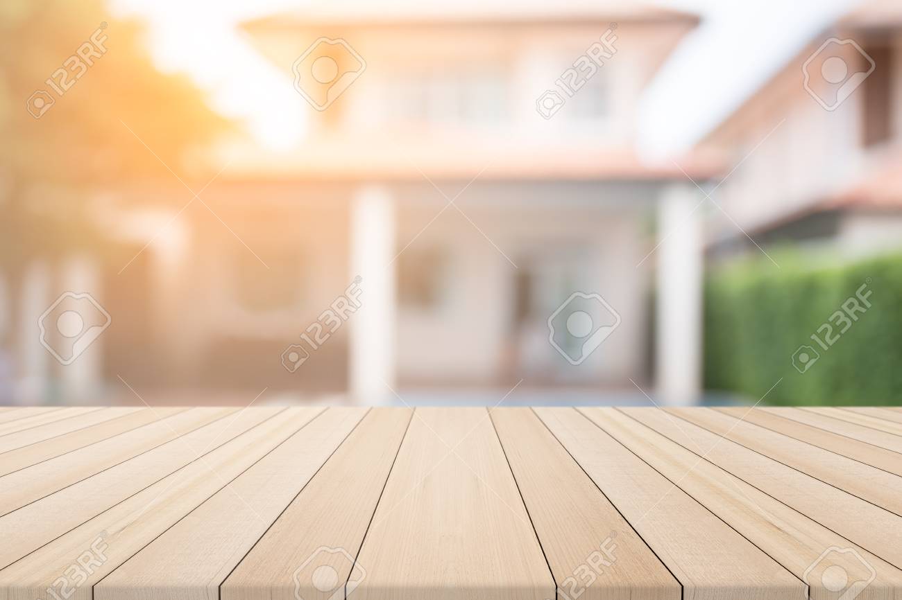 Empty Wooden Table In Front With Blurred Background Of Home