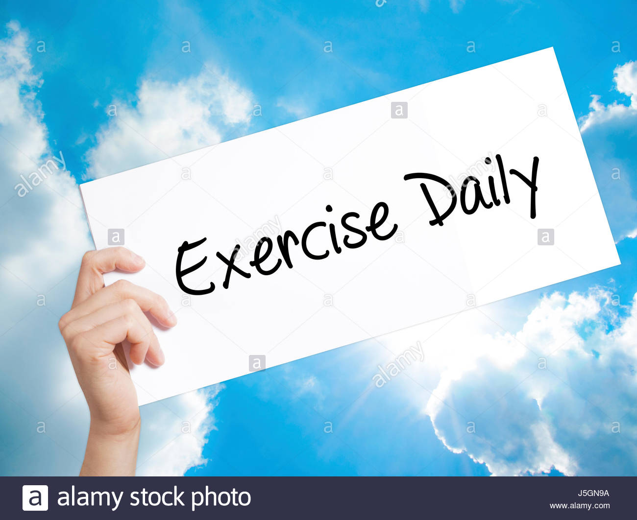 Exercise Daily Sign on white paper Man Hand Holding Paper with 1300x1062