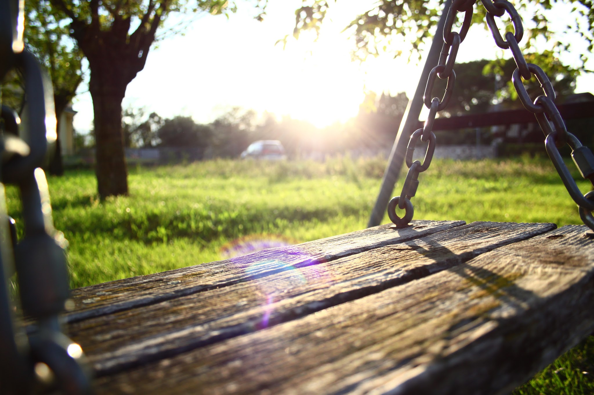 Sunset As Seen From Wooden Swing