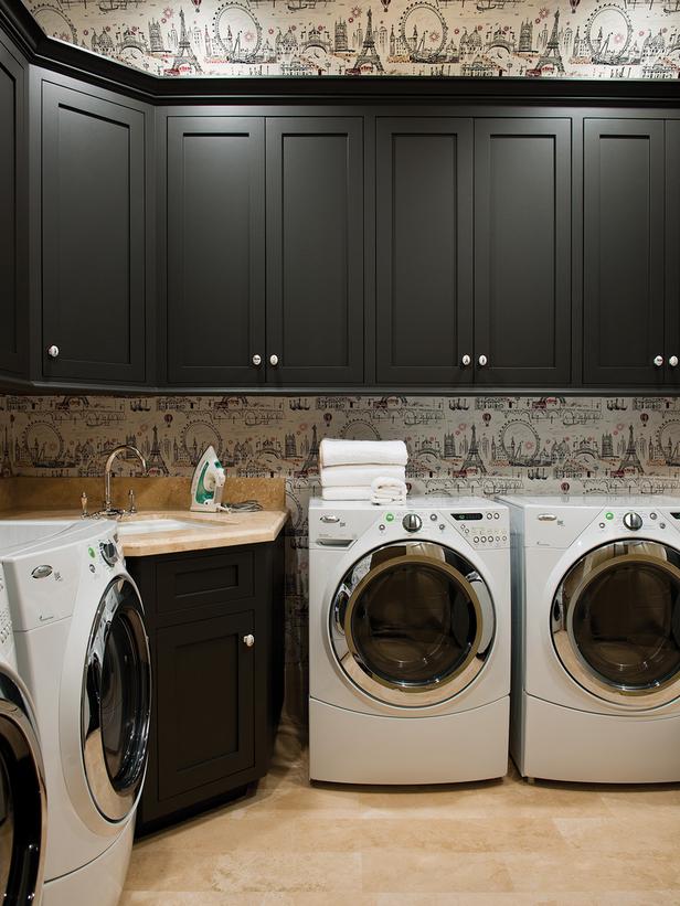 Laundry Room with Fun Wallpaper Black Cabinets and White WasherDryer