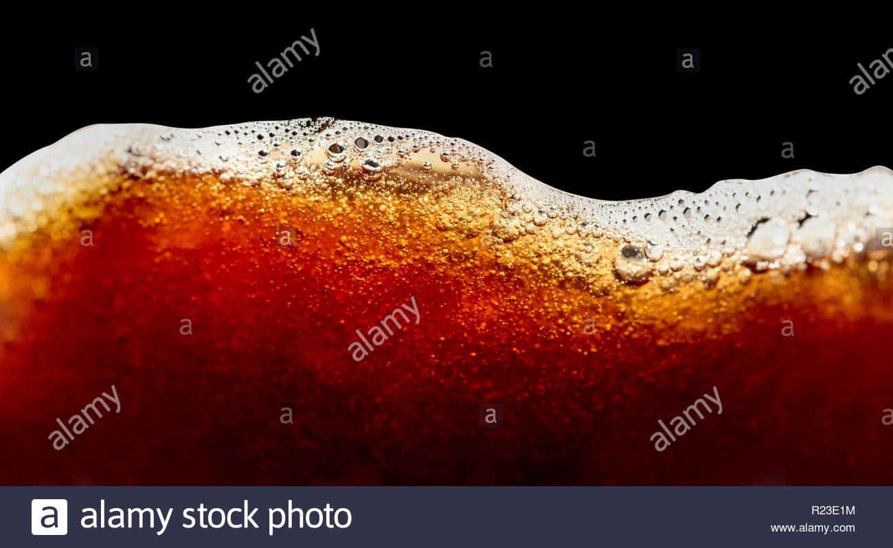 Close Up Of Coffee Splashes On A Black Background Saved Clipping