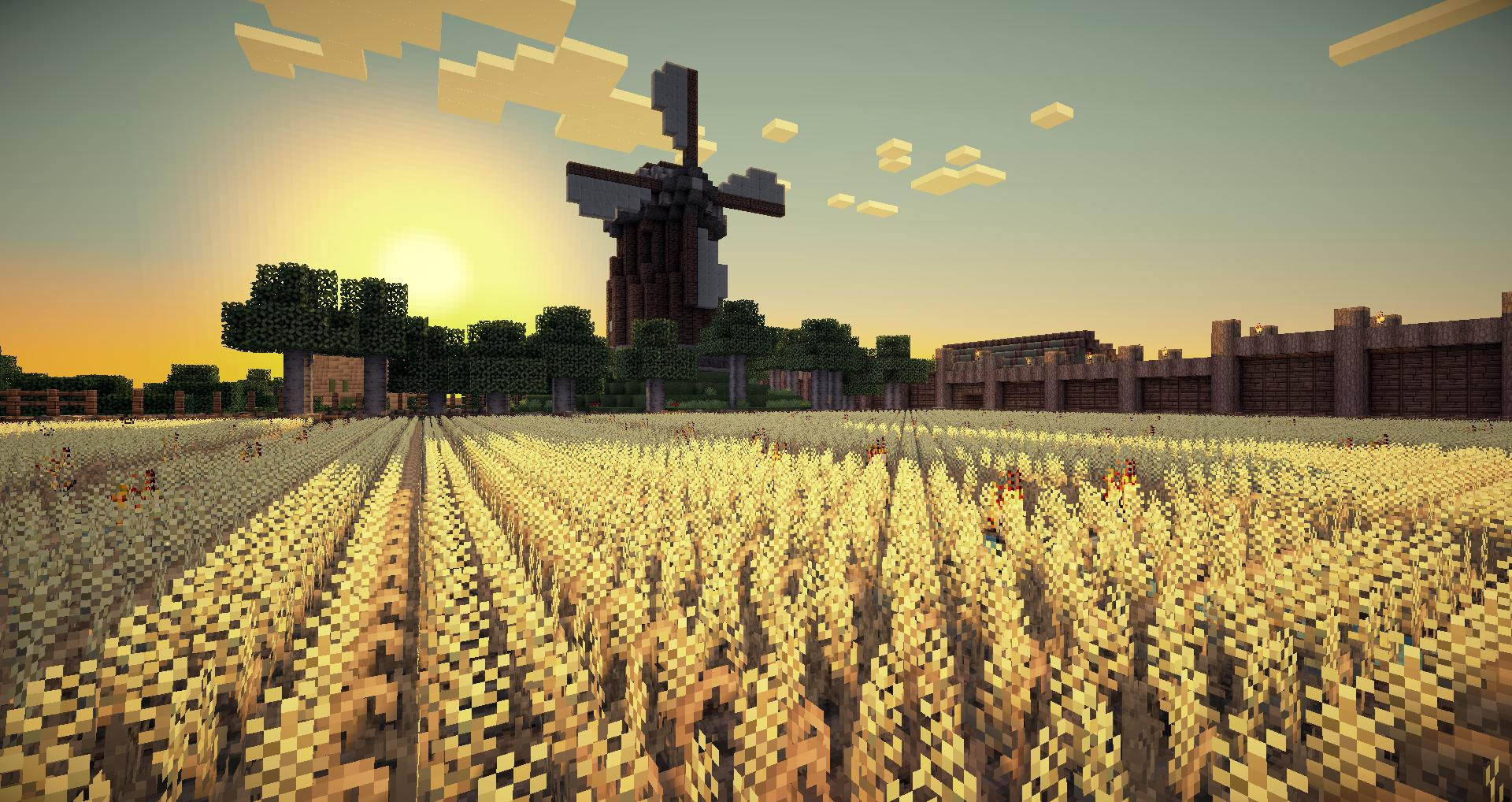A pixelated Minecraft landscape at sunset featuring a field of golden wheat, a windmill, and a wooden fence in the background