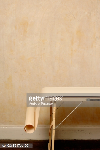 Pasting Table And Wallpaper Against Bare Wall Stock Photo Sb10065817cc