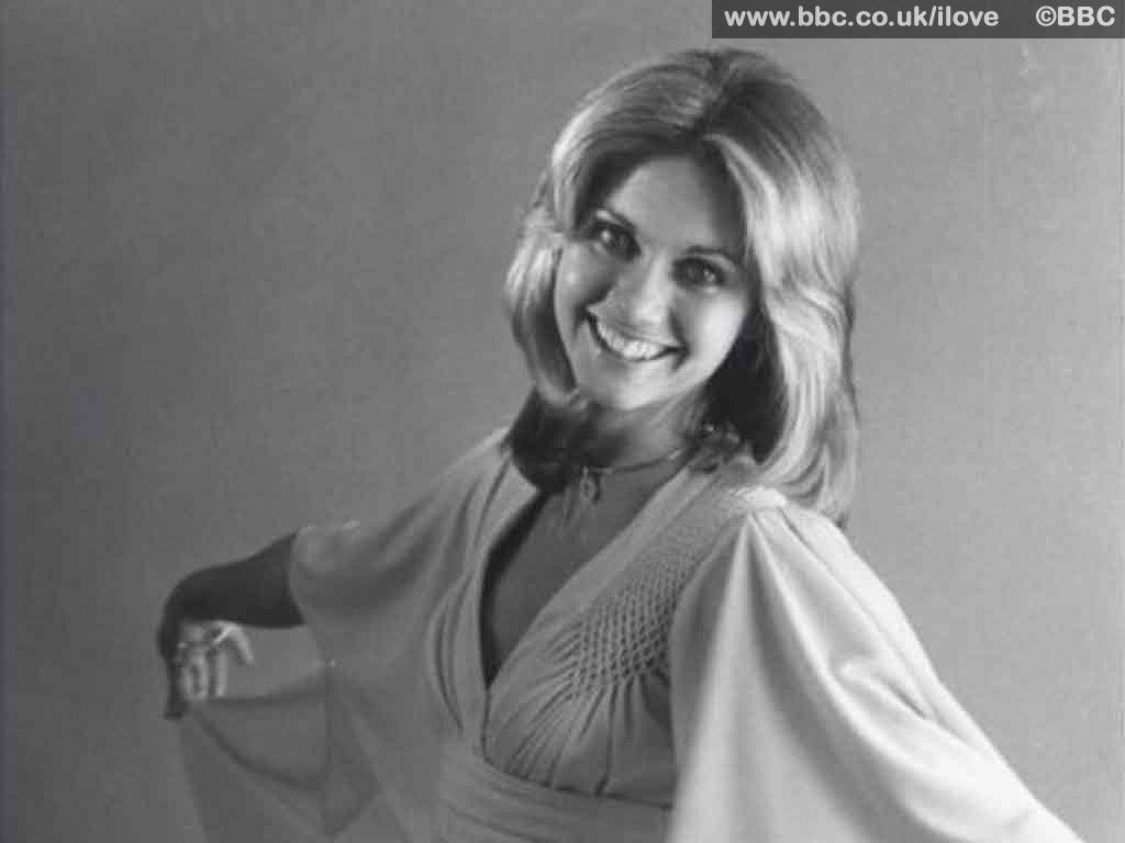 Get Physical With This Olivia Newton John Wallpaper On Your