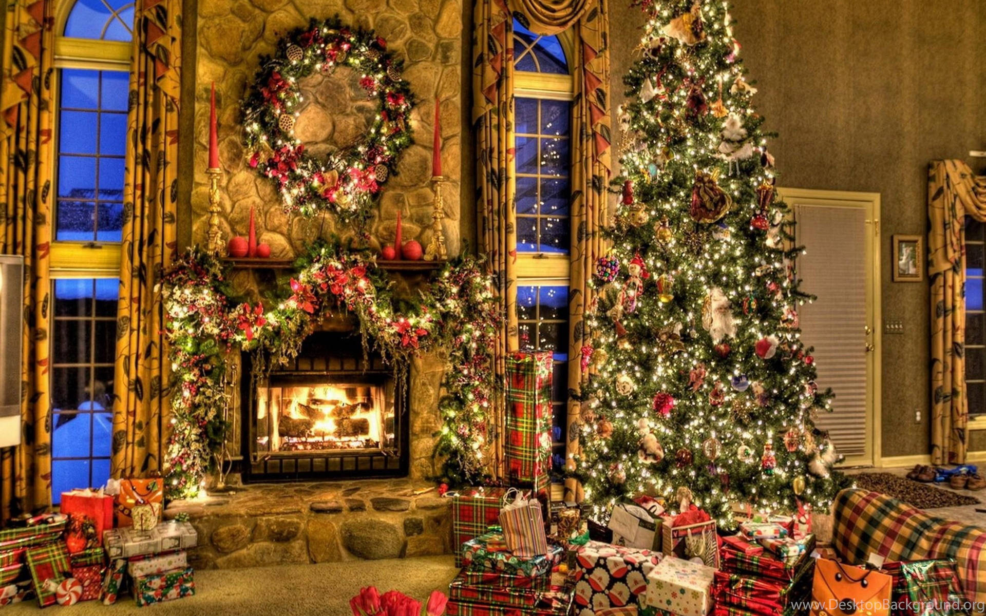 A cozy living room decorated for Christmas with a lit fireplace, a decorated Christmas tree, and wrapped presents