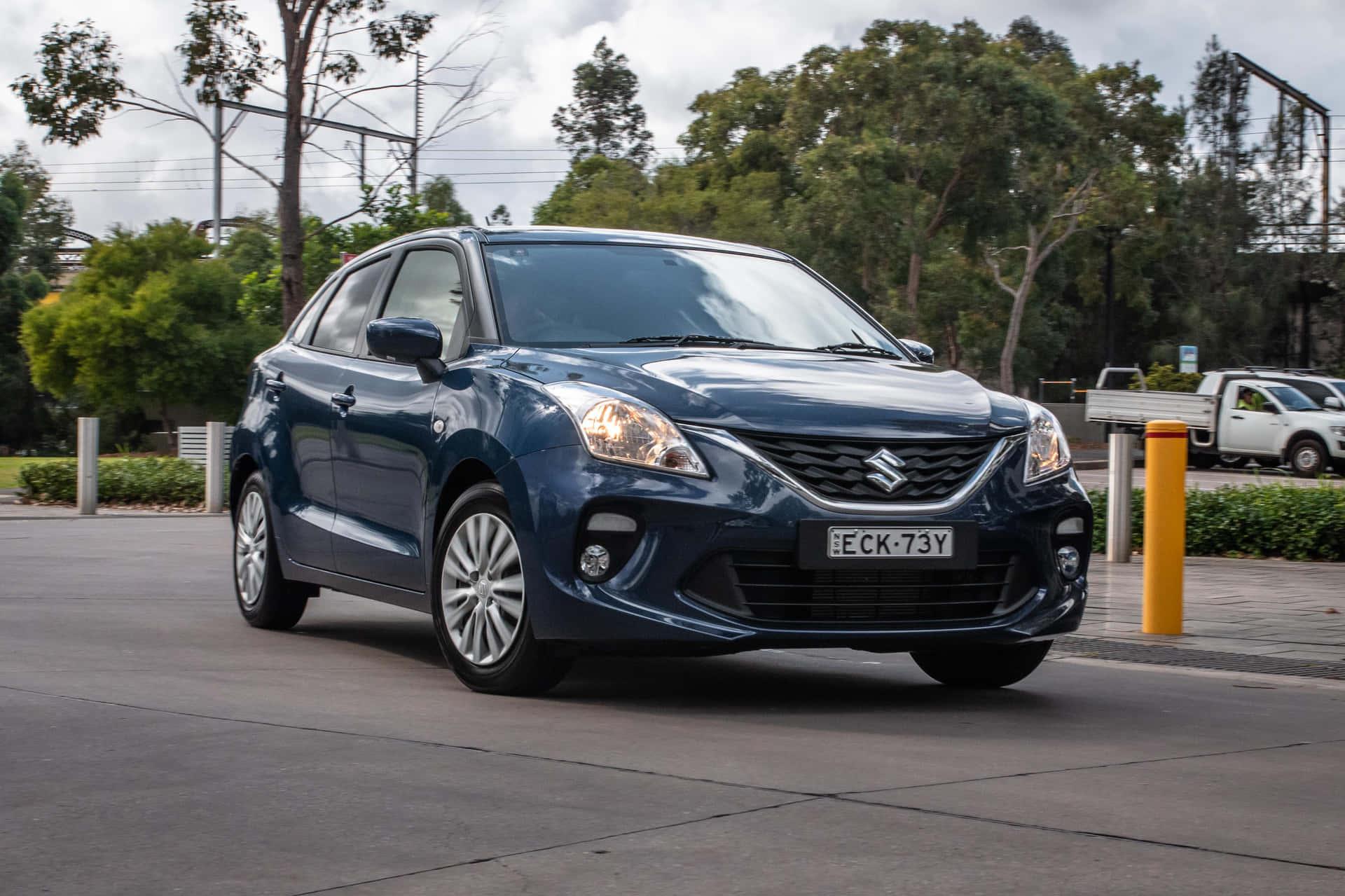 Caption Sleek Suzuki Baleno In Urban Environment