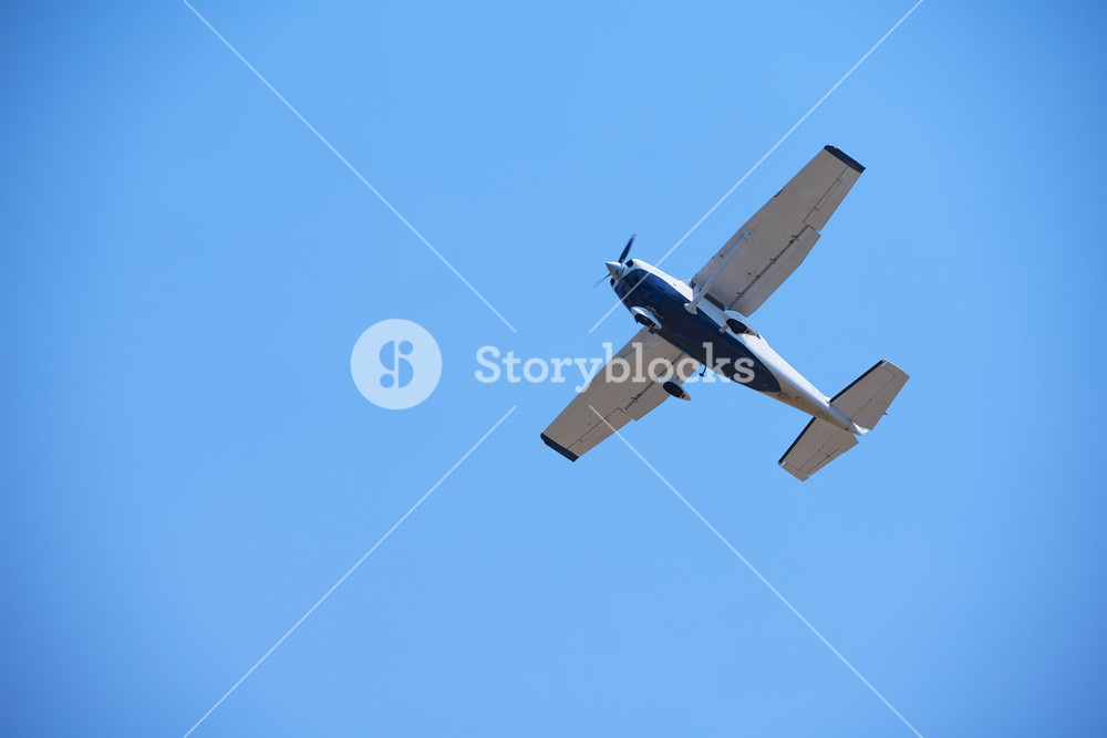 Small Retro Airplane Clear Blue Sky In Background Royalty