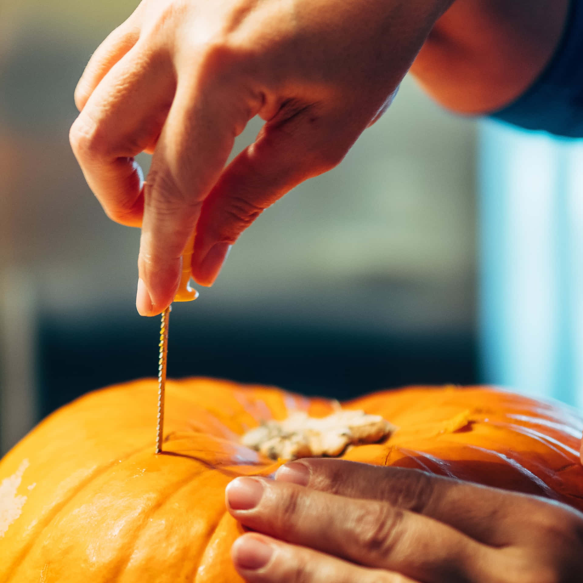 Intricate Halloween Pumpkin Carving Art Wallpaper