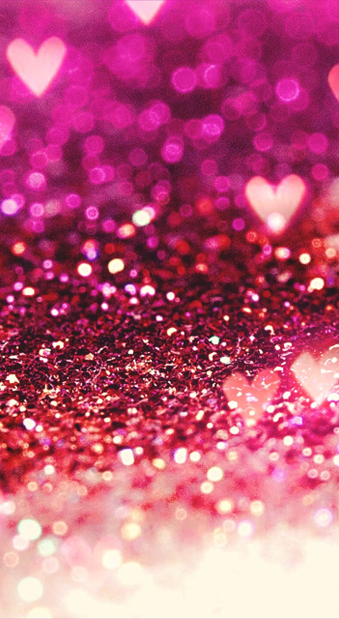 Sparkling pink glitter background with heart-shaped bokeh, creating a romantic and glamorous aesthetic