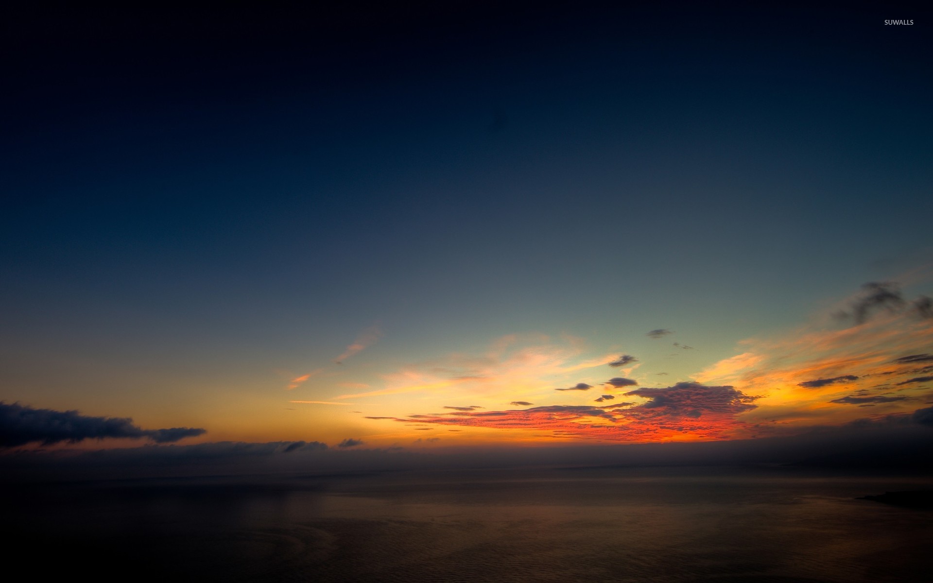 Serene Sunset Above The Ocean Wallpaper Beach