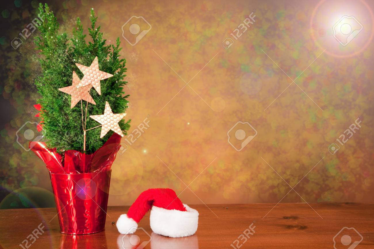 Magical Christmas Scene Background With A Santa Hat And Small