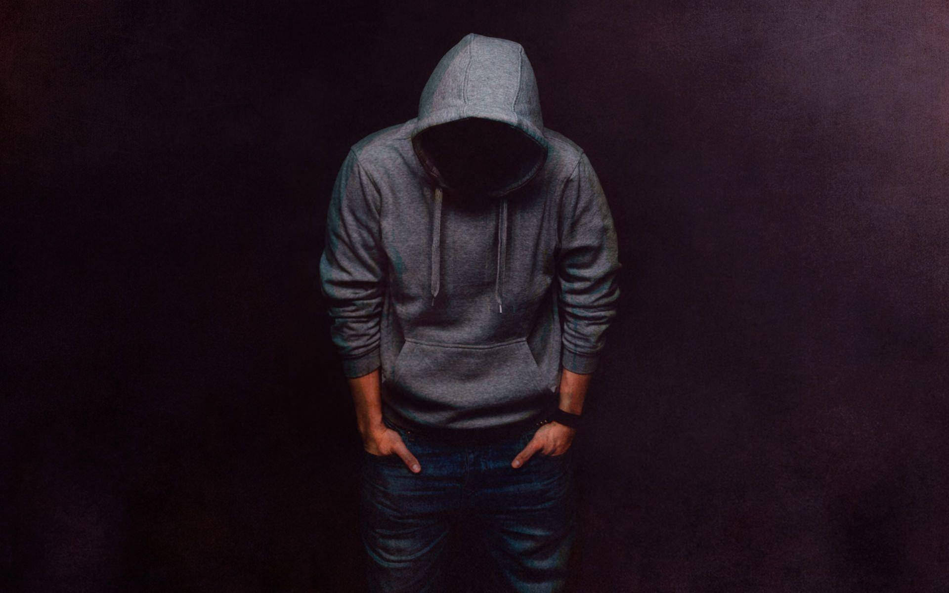 Stylish Man In Hoodie Embodying Urban Cool Wallpaper